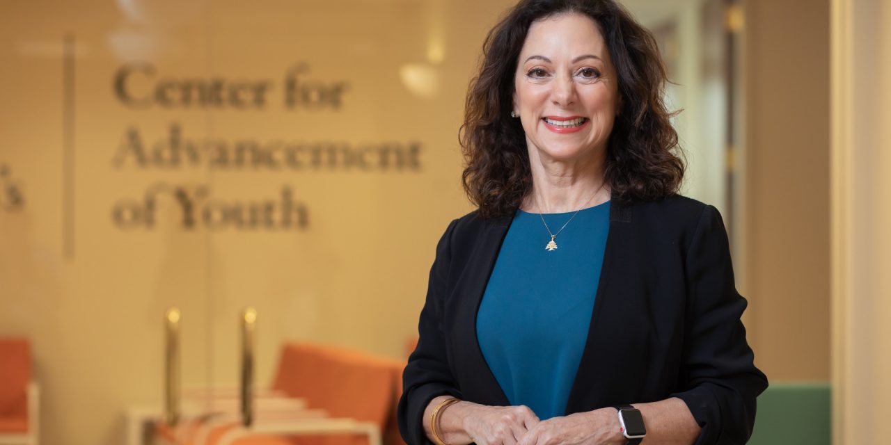 Image of woman smiling with dark hair