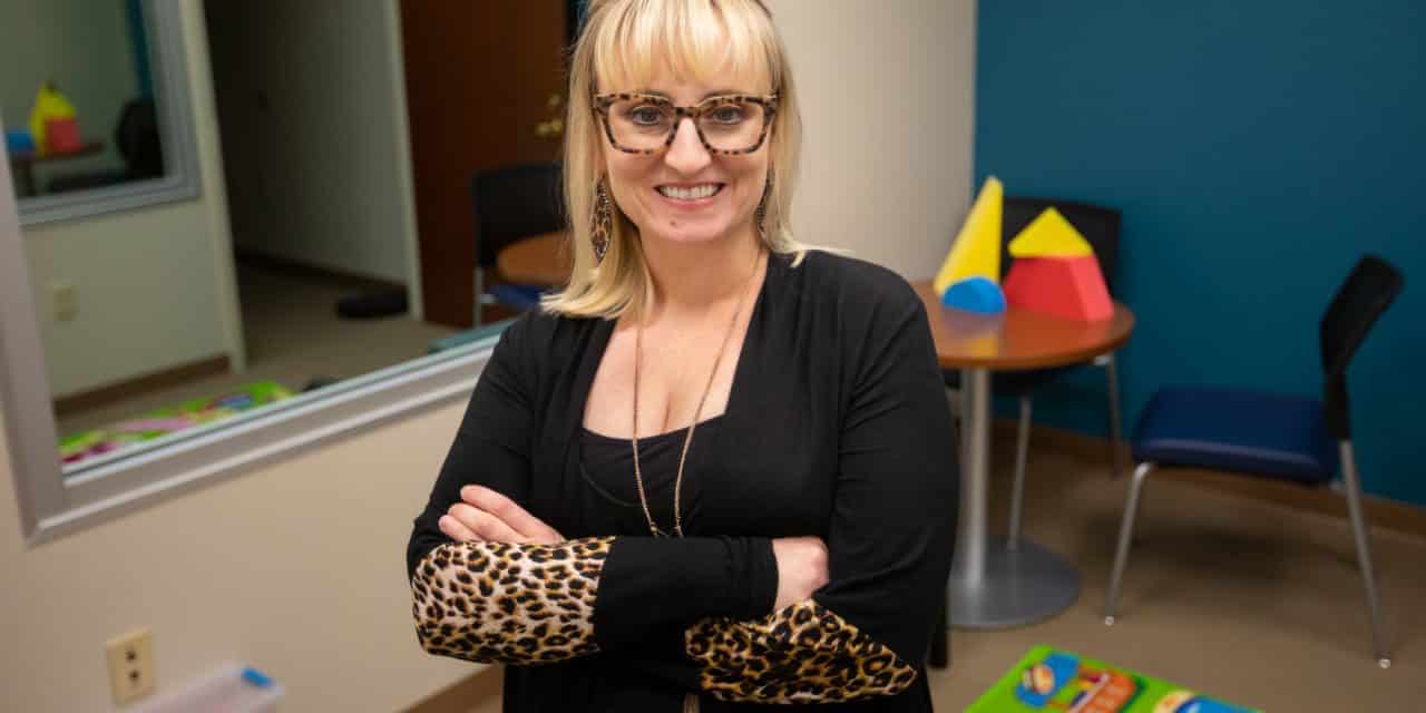 Image of woman with blond hair and glasses